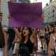 Sign above: “I don’t want to be brave on my walk home, I want to be free.”